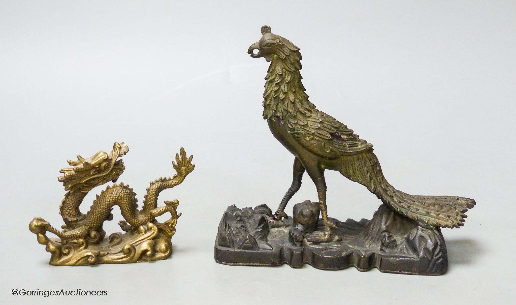 A 19th century Chinese bronze figure of a phoenix, repairs, and a 20th century Chinese bronze figure of a dragon, tallest 13.5cm